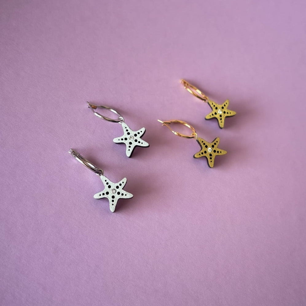 Star-shaped hair clips on a purple background